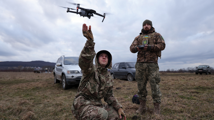 Ukrainian soldiers launch a surveillance drone in February 2023. 